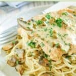 A plate of homemade Cheesecake Factory chicken piccata with pasta.