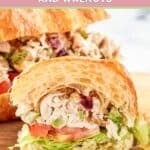 Homemade chicken salad with cranberries and walnuts in a sandwich.