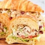 Homemade cranberry walnut chicken salad croissant sandwich.