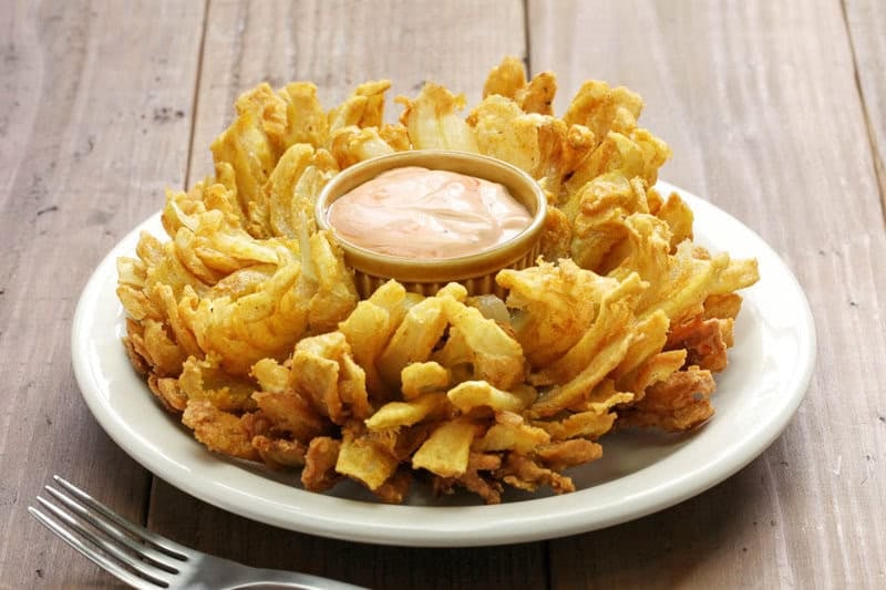 Copycat Chili's awesome blossom and dipping sauce on a plate.