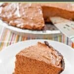 Homemade chocolate pudding pie and a slice on a plate in front of it.