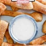 Homemade Domino's cinnastix around a small cup of icing dipping sauce.