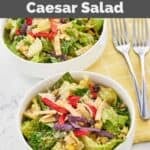 Bowls of Houston's southwest caesar salad and forks next to them.