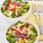 Two bowls of homemade Houston's southwest caesar salad and two forks.