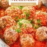 Homemade Olive Garden meatballs and sauce in a skillet.