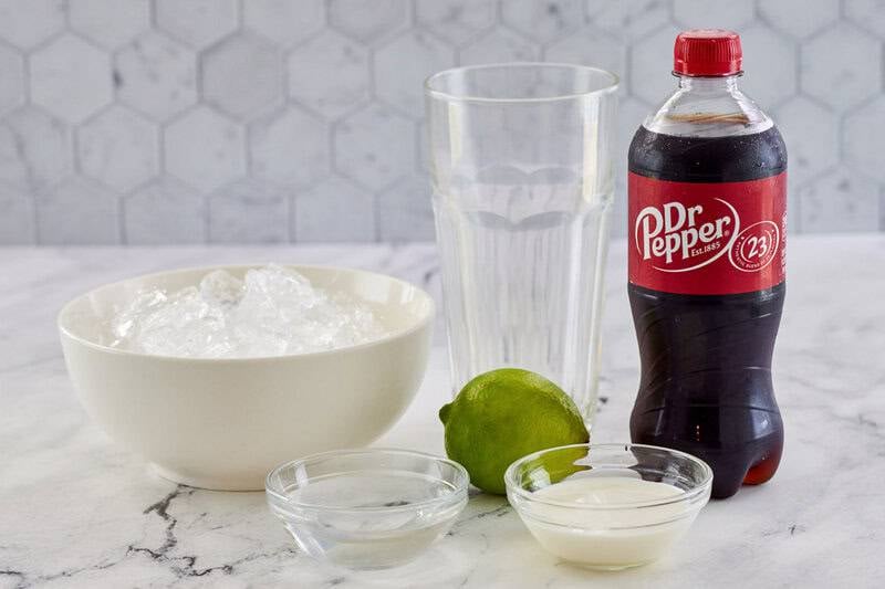 Copycat Sonic Dirty Dr. Pepper drink ingredients on a marble surface.