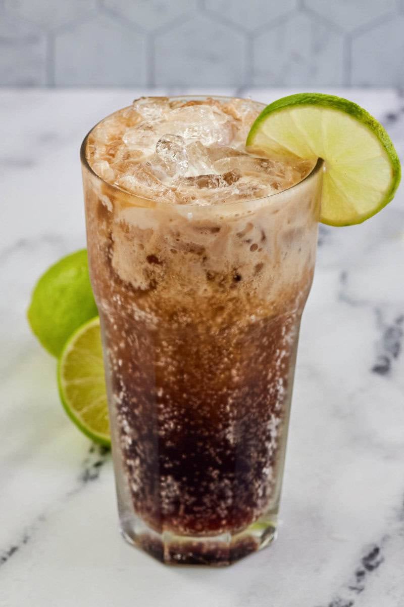 Copycat Sonic Dirty Dr. Pepper drink garnished with lime.