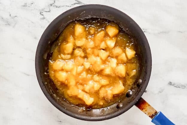 Caramel apple filling for copycat Taco Bell empanadas in a skillet.