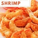 Homemade beer battered fried shrimp on a plate.