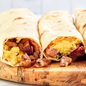 Two copycat Buc-ee's egg and smoked brisket breakfast tacos.