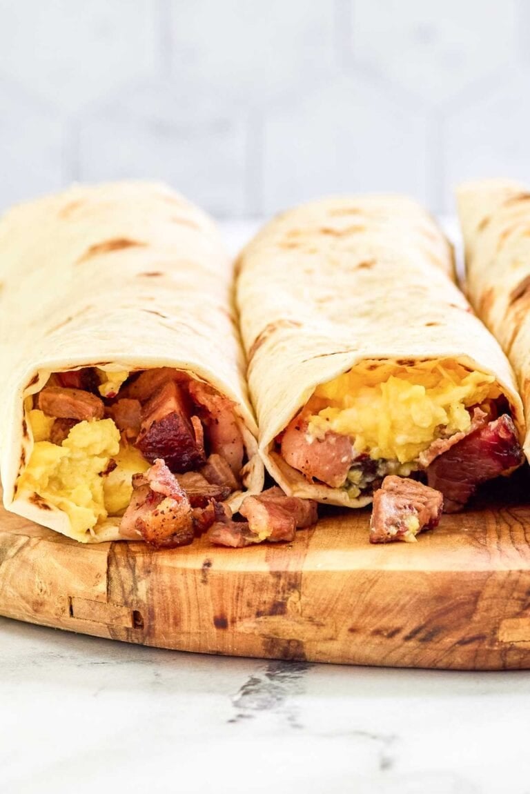 Two copycat Buc-ee's egg and smoked brisket breakfast tacos.