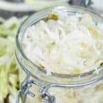 A glass jar filled with homemade coleslaw that keeps.