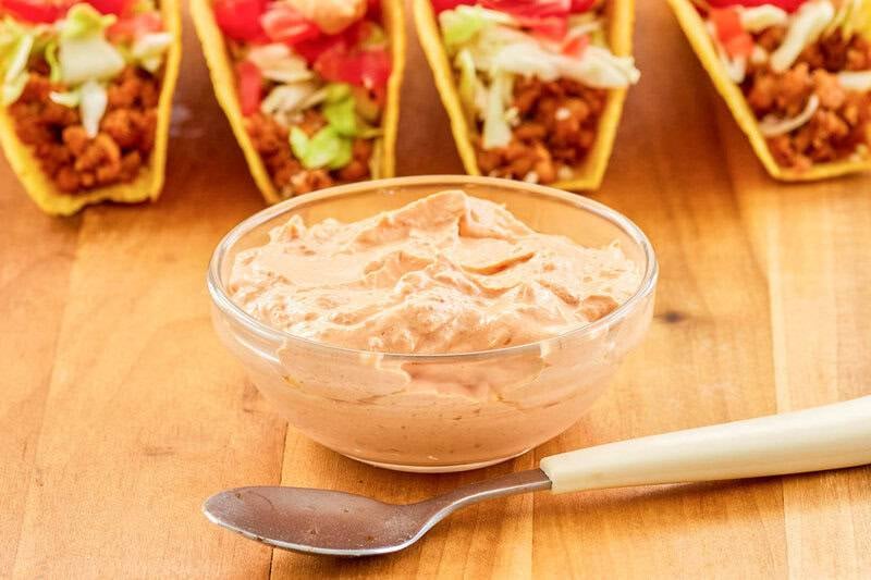 Copycat Taco Bell chipotle sauce in a small bowl and a spoon in front of it.