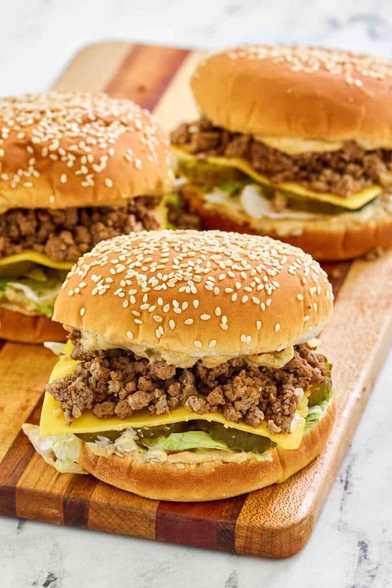 Big mac sloppy joes on a cutting board.