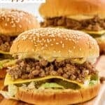 Three homemade big mac sloppy joes on a wood board.