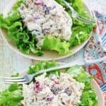 Two scoops of copycat Chicken Salad Chick Fancy Nancy chicken salad on lettuce.