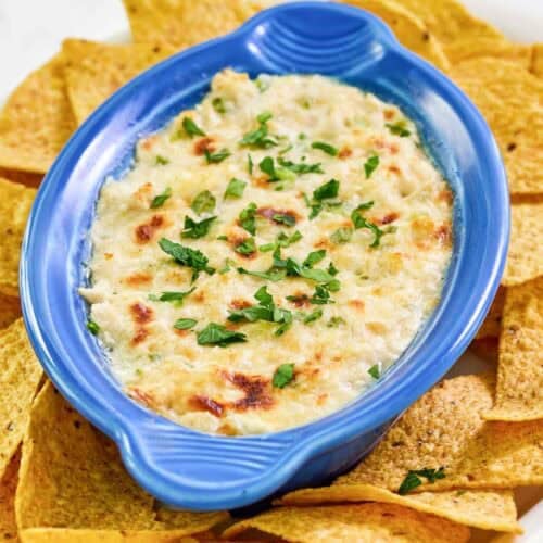 Copycat Joe's crab shack crab dip and tortilla chips on a platter.