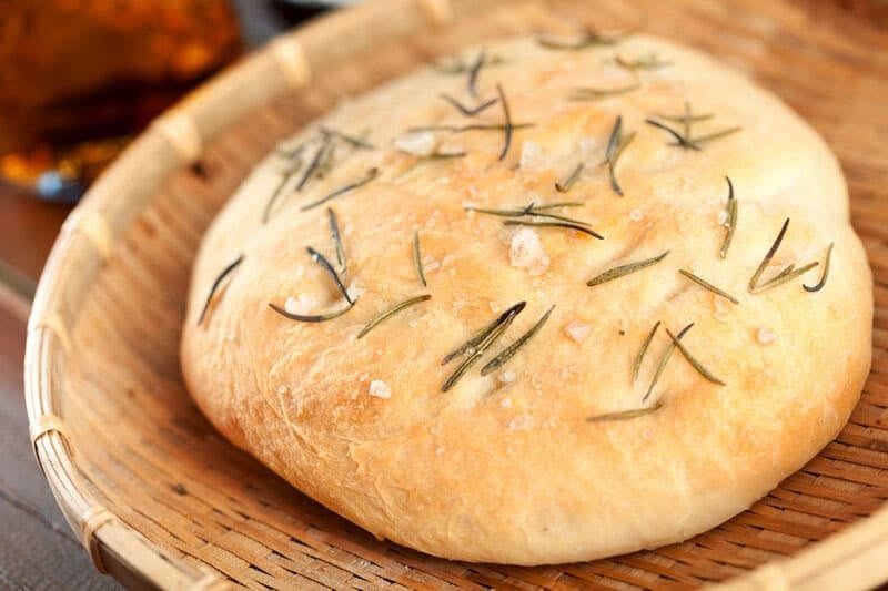 Copycat Macaroni Grill rosemary peasant bread in a basket.