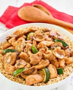 Copycat Panda Express mushroom chicken over rice in a bowl.