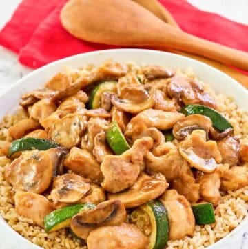 Copycat Panda Express mushroom chicken over rice in a bowl.