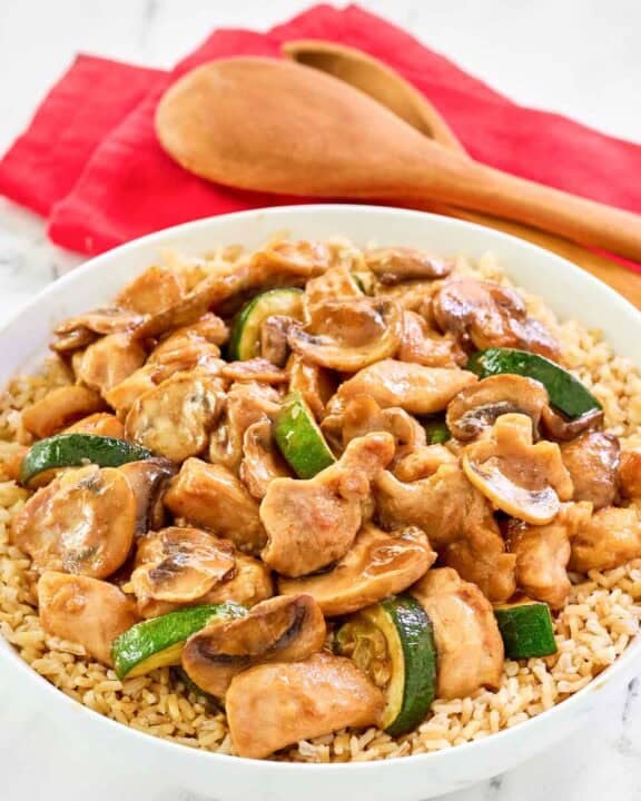 Copycat Panda Express mushroom chicken over rice in a bowl.