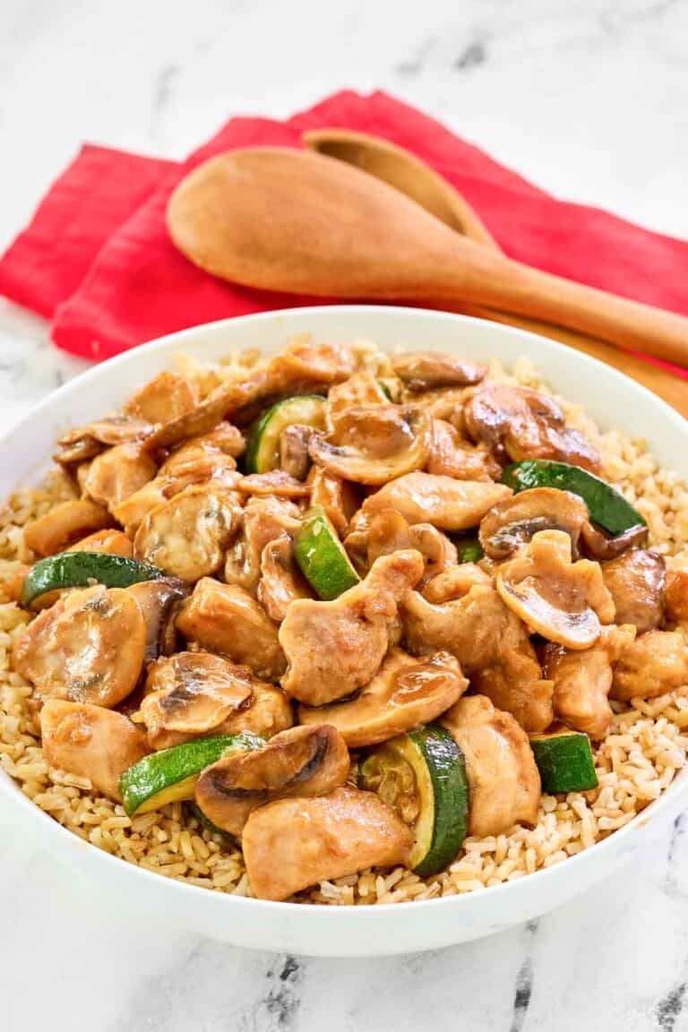 Copycat Panda Express mushroom chicken over rice in a bowl.