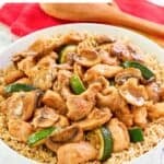 A bowl of homemade Panda Express mushroom chicken over rice.