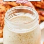 A mason jar filled with homemade Popeyes blackened ranch.