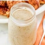 Homemade Popeyes blackened ranch sauce in a glass jar.