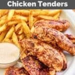Homemade Popeyes blackened chicken tenders, fries, and dipping sauce on a plate.