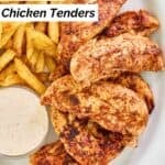 Homemade Popeyes blackened tenders, fries, and a cup of dipping sauce.
