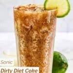 A glass of homemade sonic dirty diet coke garnished with a lime wheel.