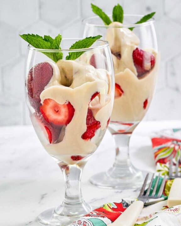 Copycat La Madeleine strawberries romanoff in wine glasses.