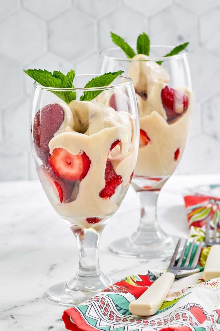 Copycat La Madeleine strawberries romanoff in wine glasses.
