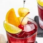 Copycat Applebee's red apple sangria in a lowball glass.