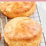 Two copycat Bojangles biscuits on a wire rack.
