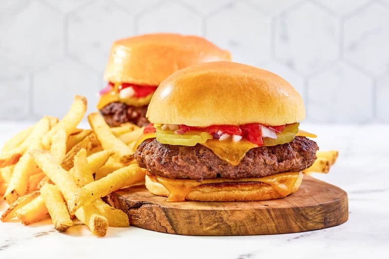 Copycat Chili's big qp burger served with French fries.
