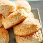 Several homemade Cracker Barrel biscuits on a plate.