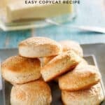 Homemade Cracker Barrel buttermilk biscuits piled on a plate.