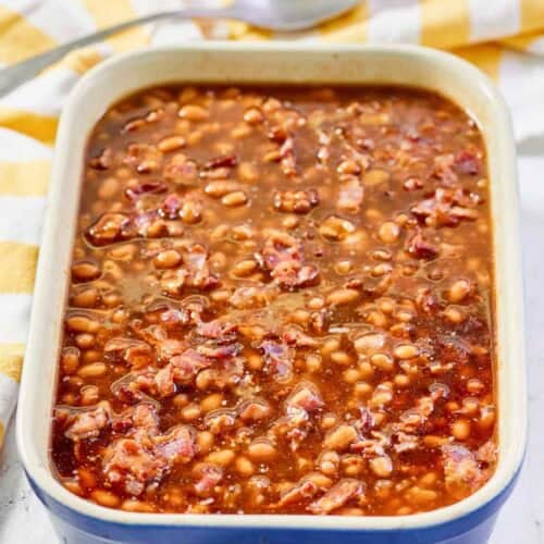 Copycat Durgin Park Boston baked beans and a serving spoon behind it.