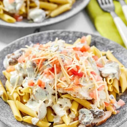 Copycat Johnny Carino's chicken gorgonzola on two plates.