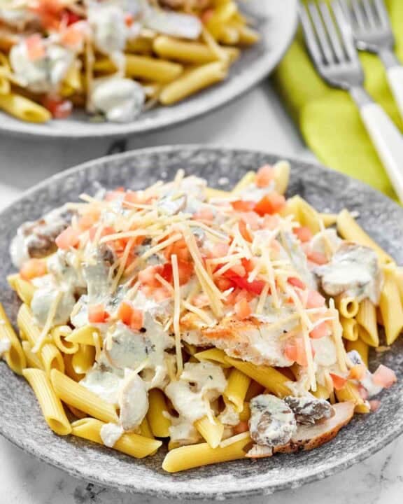 Copycat Johnny Carino's chicken gorgonzola on two plates.
