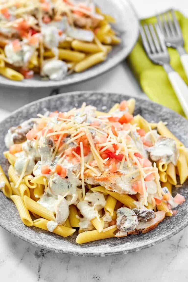 Copycat Johnny Carino's chicken gorgonzola on two plates.