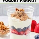 Homemade McDonald's fruit and yogurt parfait, granola, strawberries, and blueberries.
