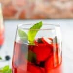 A glass of homemade Olive Garden berry sangria.