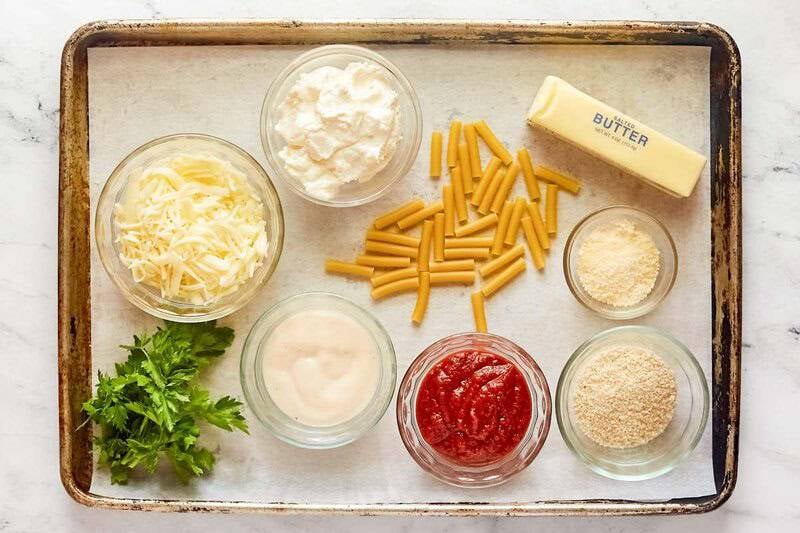 Copycat Olive Garden five cheese ziti al forno ingredients on a tray.