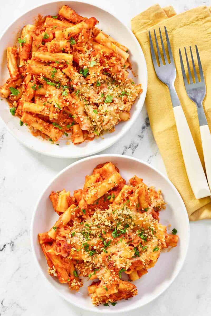 Two servings of copycat Olive Garden five cheese ziti al forno.