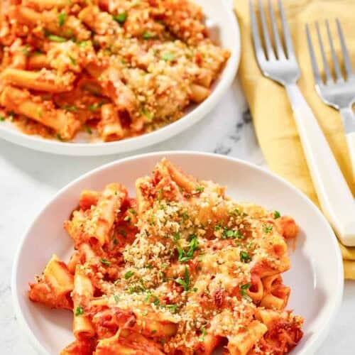 Copycat Olive Garden five cheese ziti al forno on two plates.