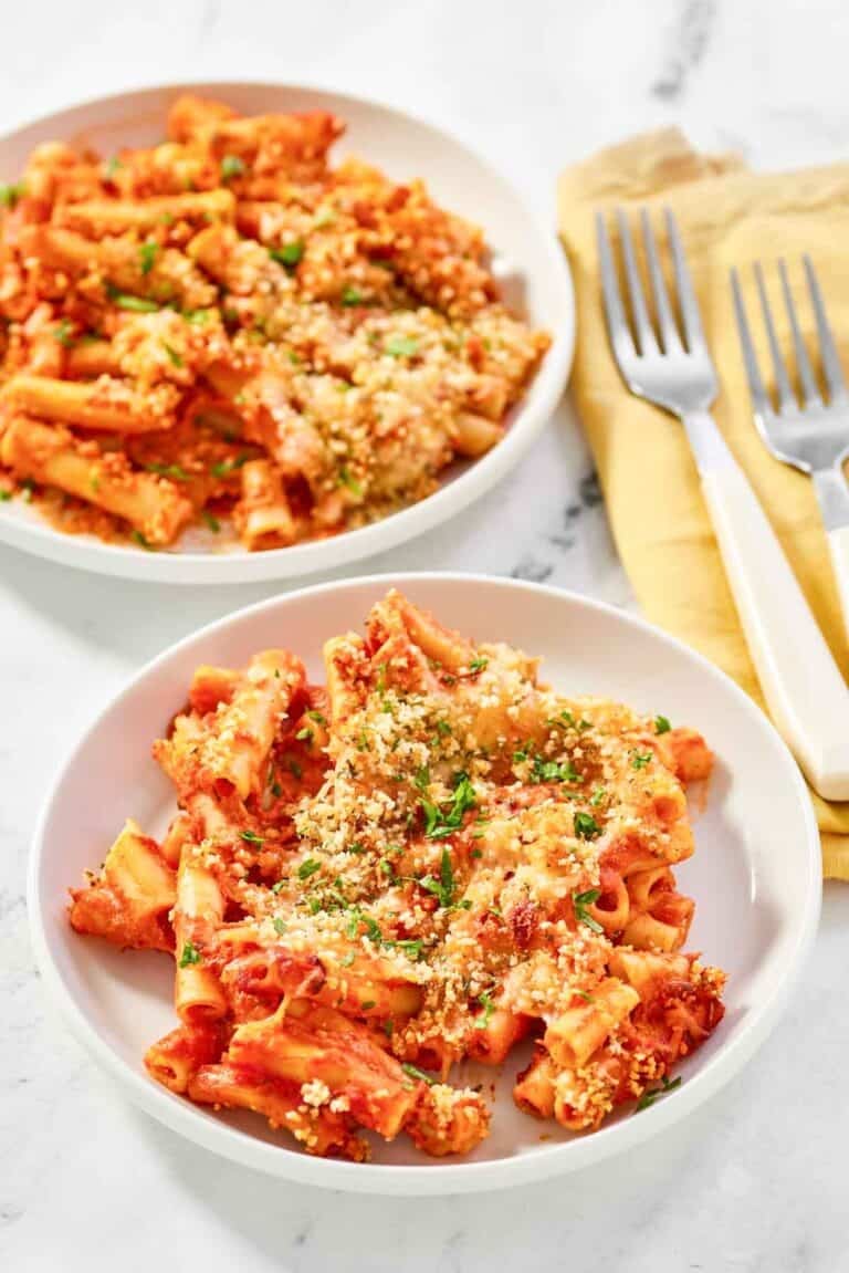 Copycat Olive Garden five cheese ziti al forno on two plates.