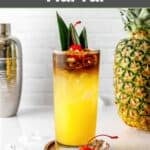 Homemade PF Chang's mai tai drink, a pineapple, and cocktail shaker.
